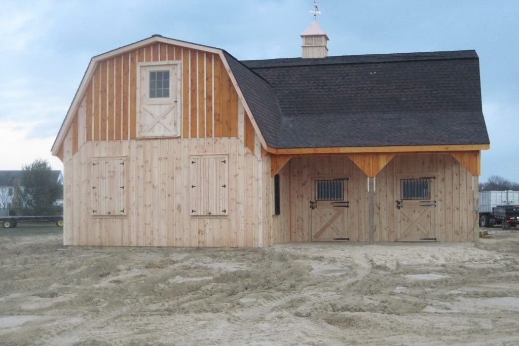 rustic two-tone barn for housing horses Natural wood two-tone barn rustic siding