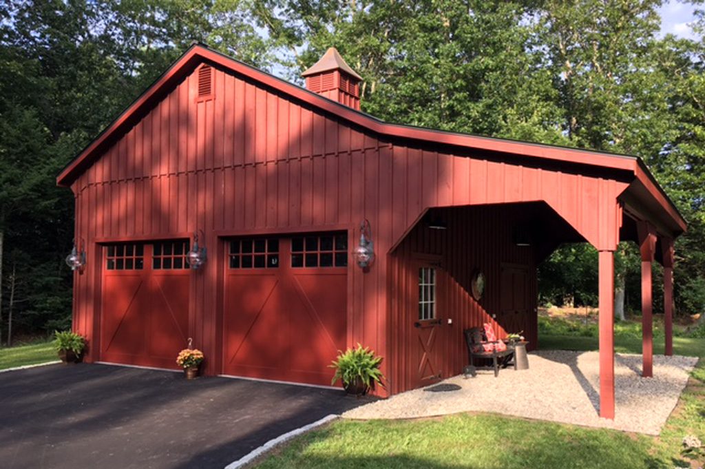 Red Garage with Paved Driveway and Landscaping