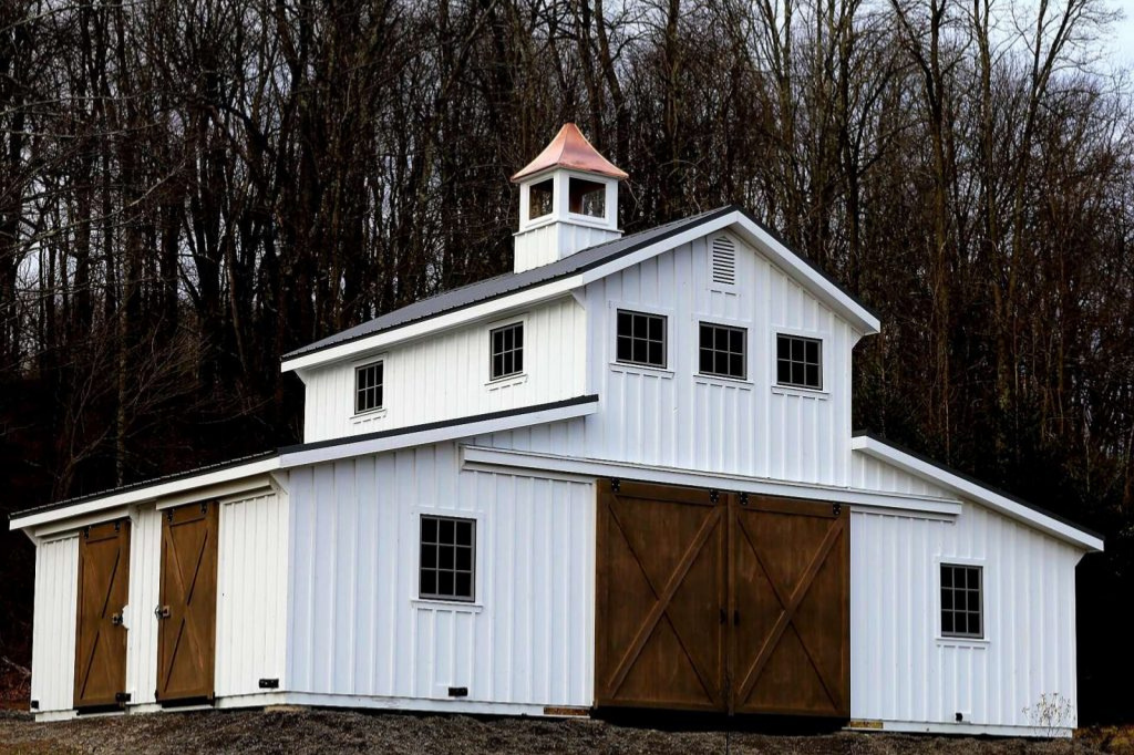 Rustic board and batten barn with cupola