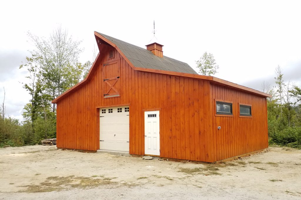 Barn garage with natural wood finish and bonus storage