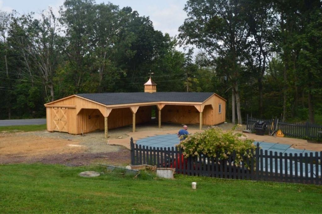 L shaped barn by pool 