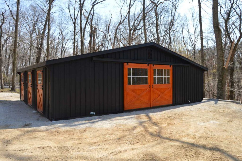 modern black barn with natural wood door