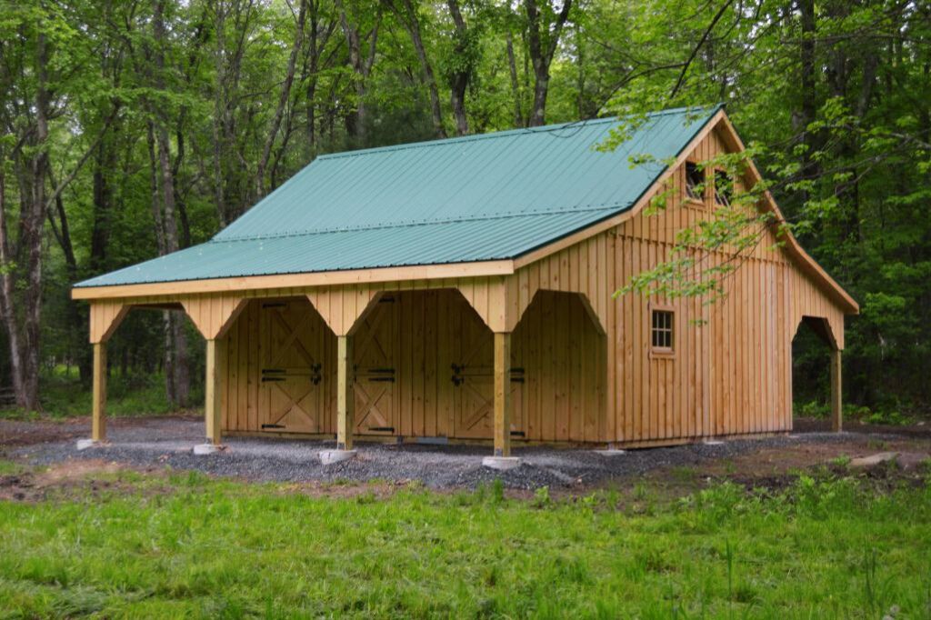 horse barn with green roof